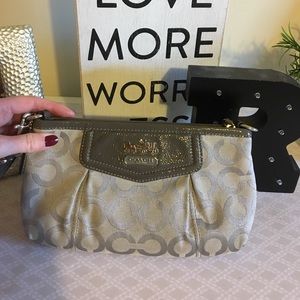 Silver colored COACH wristlet